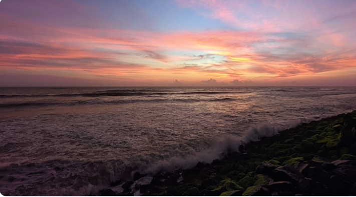 Anjuna Beach dramatic sunset with red cliffs