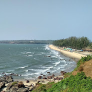 Keri Beach dramatic sunset with red cliffs