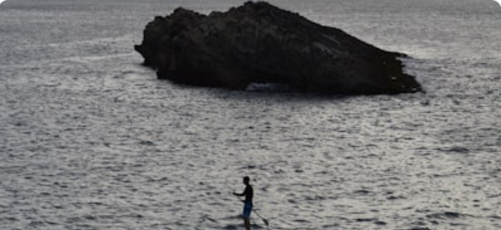 Person enjoying water sports on Goa beach